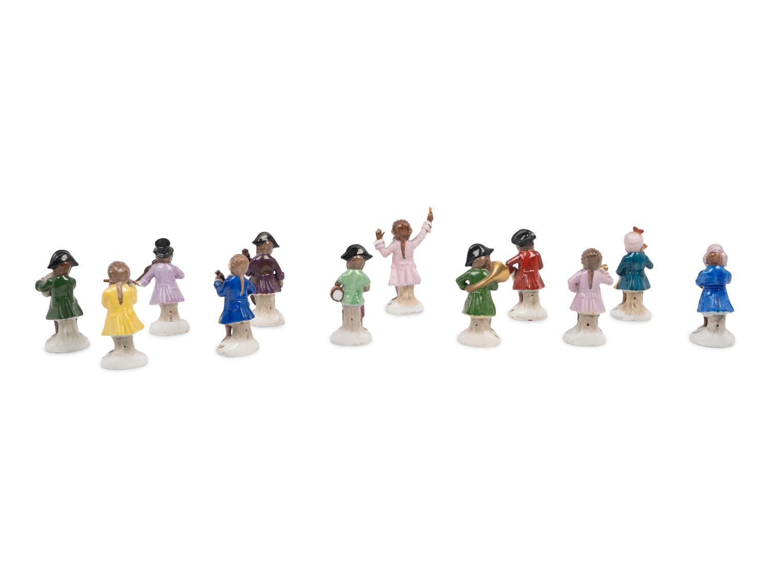 A German Porcelain Twelve-Piece Monkey Band