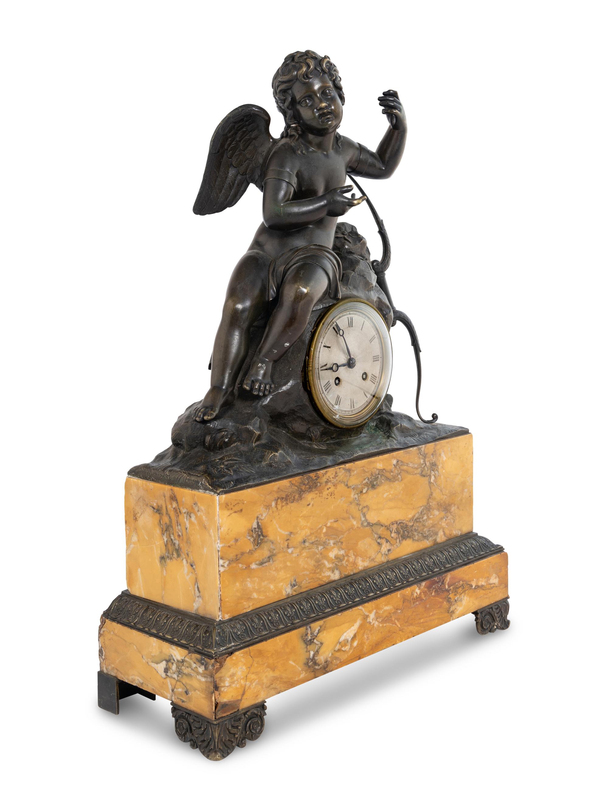 A Louis Philippe Bronze and Marble Figural Clock