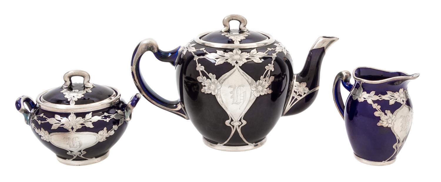 A Lenox Porcelasin Silver Overlay Tea Service Height of teapot 5 3/4 inches.