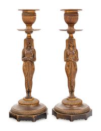 A Pair of Egyptian Revival Bronze Figural Candlesticks