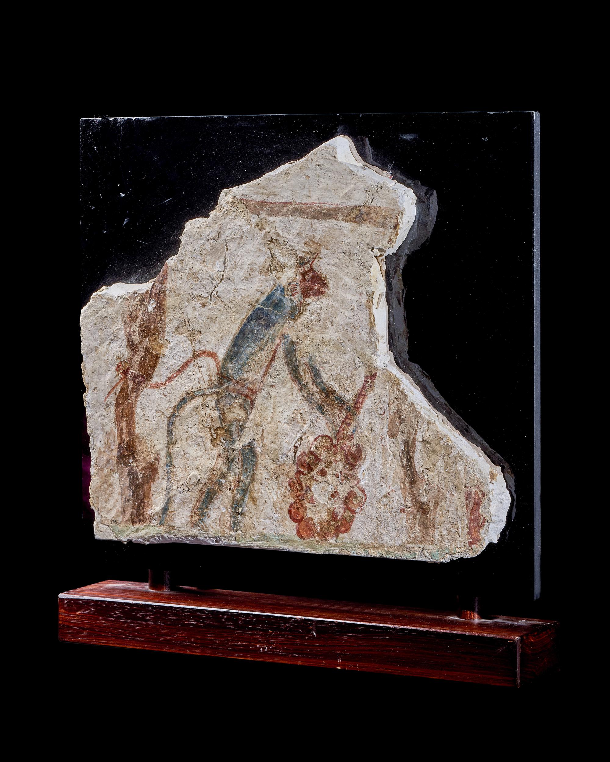 An Egyptian Painted Limestone Fragment