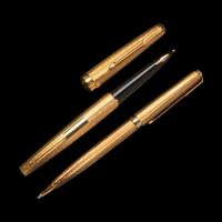 A Parker 18-Karat Gold Fountain Pen and Rollerball Pen Set