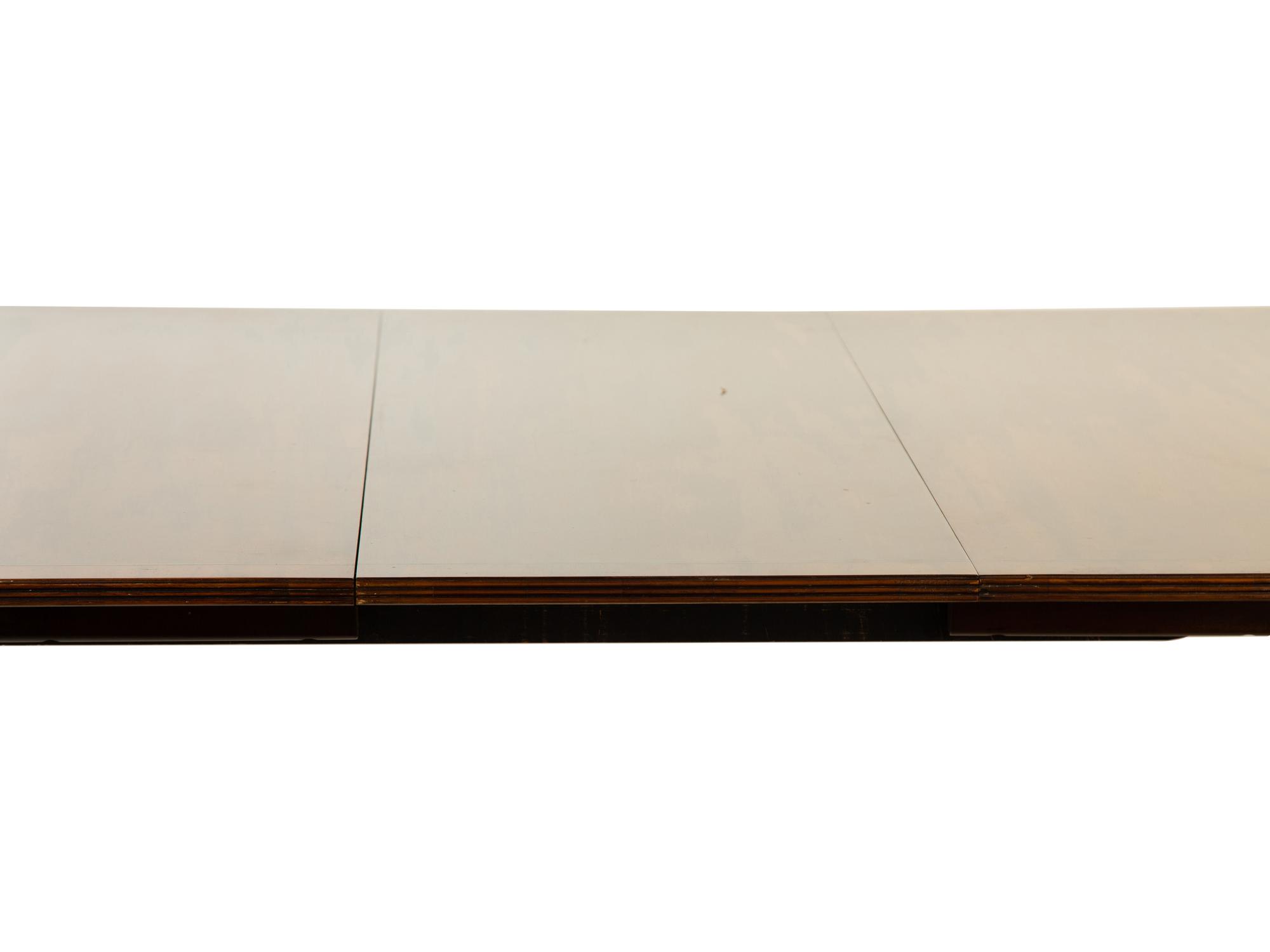 A Baker George III Style Mahogany Double-Pedestal Dining Table