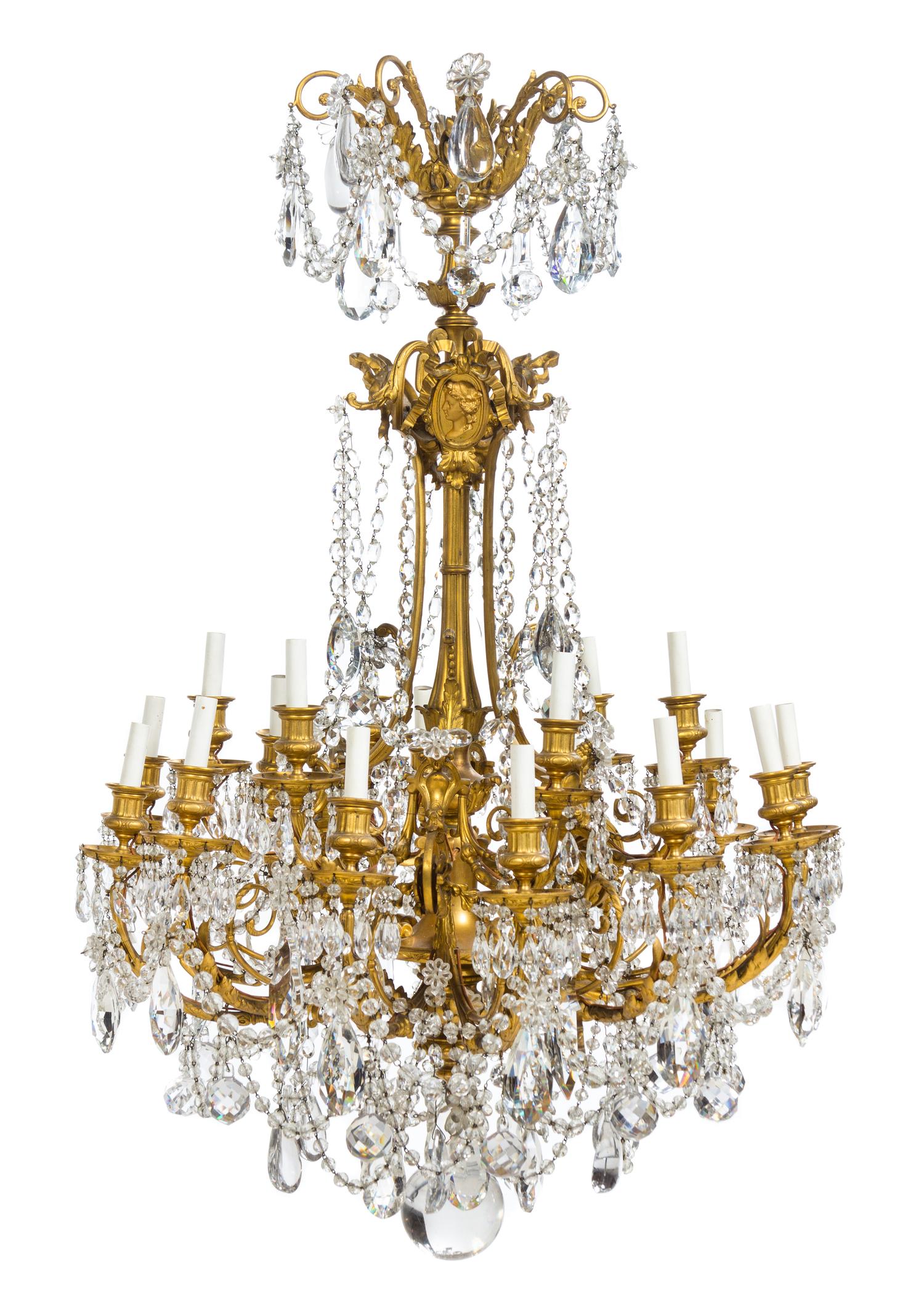 A Louis XVI Style Gilt Bronze Eighteen-Light Chandelier Height 42 x diameter 28 inches.