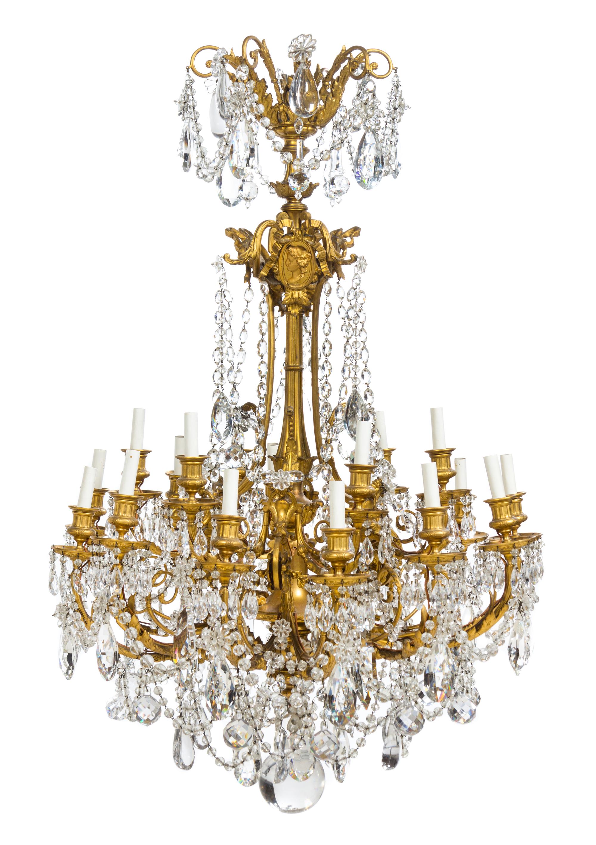 A Louis XVI Style Gilt Bronze Eighteen-Light Chandelier Height 42 x diameter 28 inches.