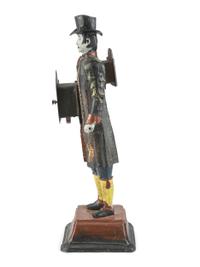 A Painted Cast-Iron 'Clock Peddler' Figural Desk Clock