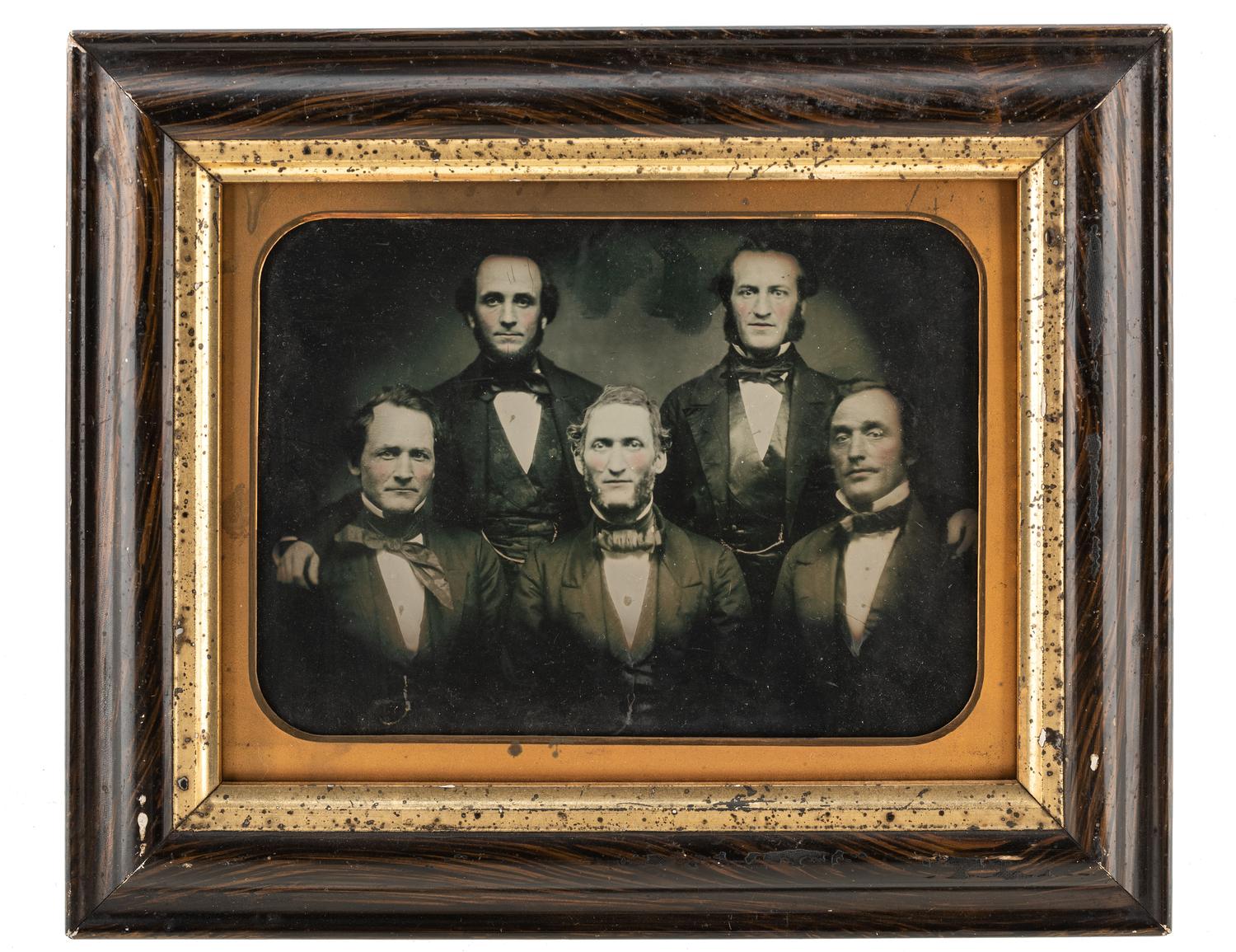 [EARLY PHOTOGRAPHY - PORTRAITURE]. A group of 7 daguerreotype and ambrotype portraits of men, many with interesting and unusual expressions and features, highlighted by full plate ambrotype of group of distinguished gents.