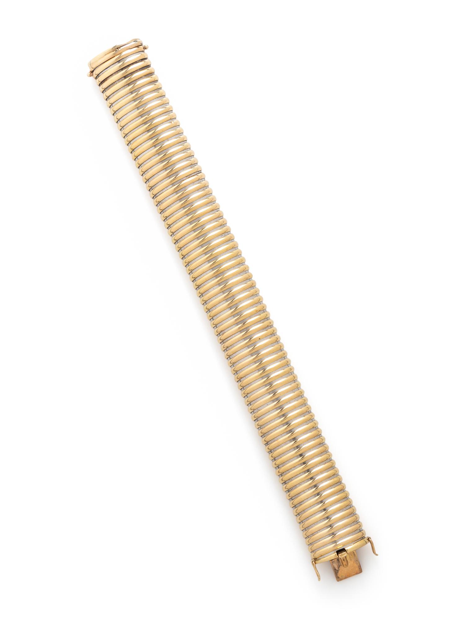 CARTIER, YELLOW GOLD AND STEEL TUBOGAS BRACELET
