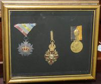 A Group of Three Medals Height of frame 8 1/2 x width 9 7/8 inches.