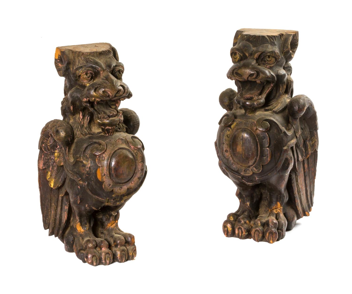 A Pair of Carved Wood Griffins, Height 15 1/2 inches.