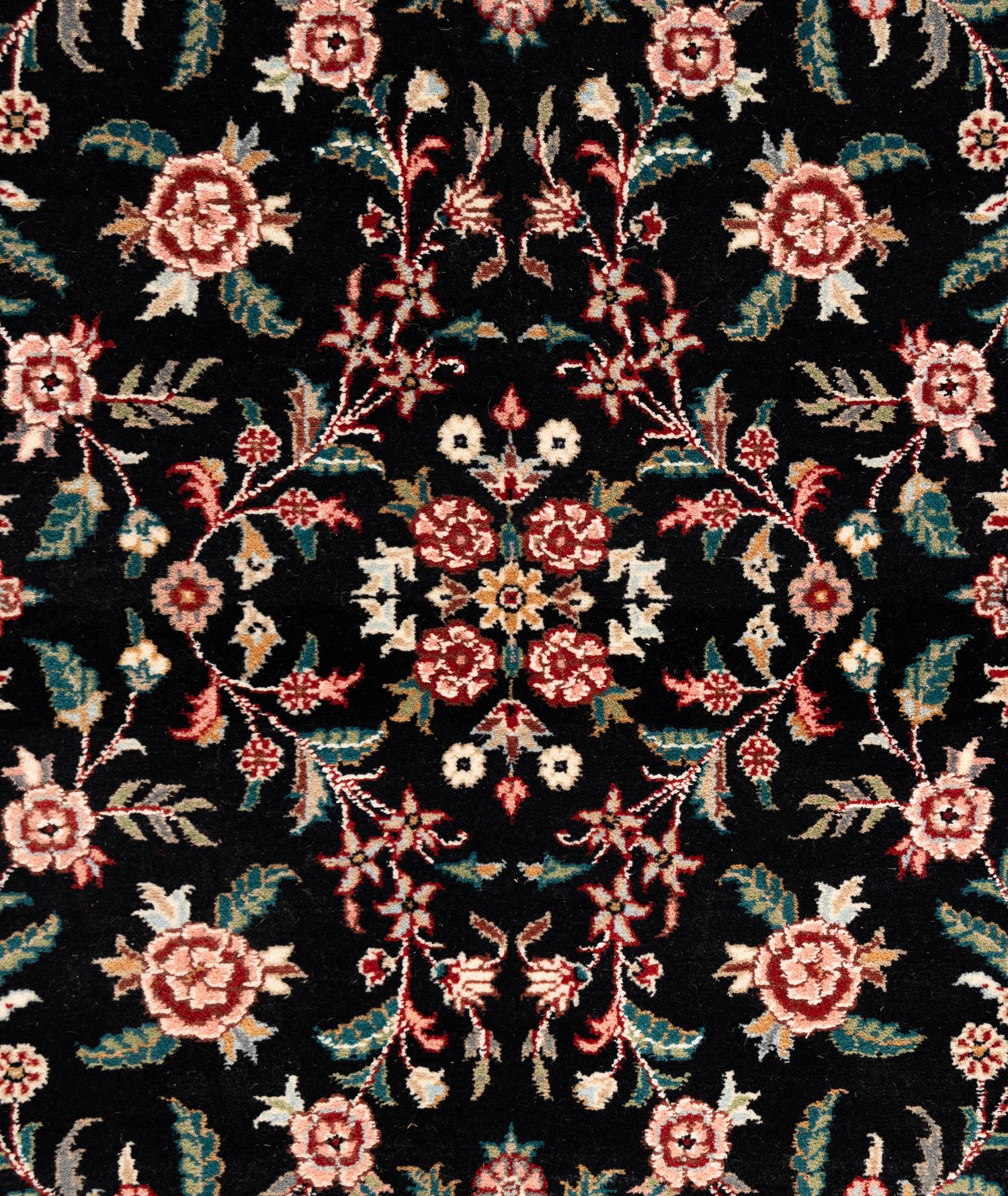 An Indo-Kashan Wool Rug