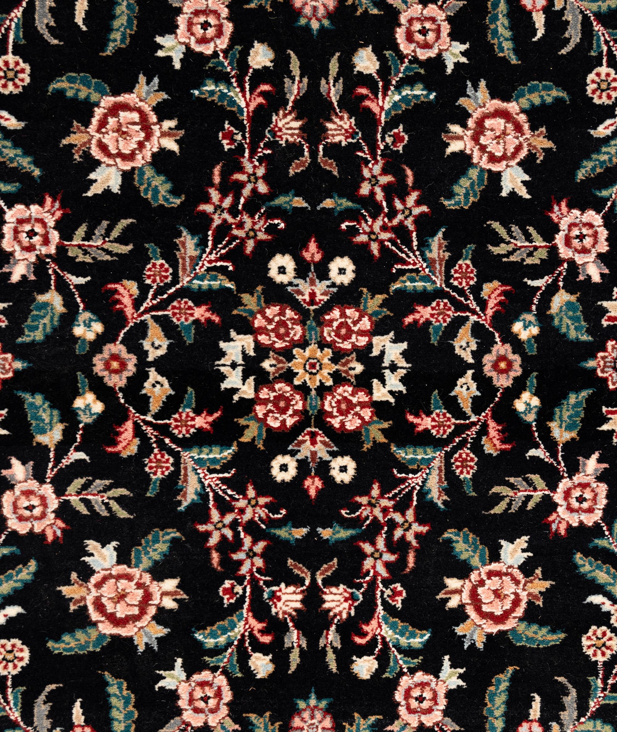An Indo-Kashan Wool Rug