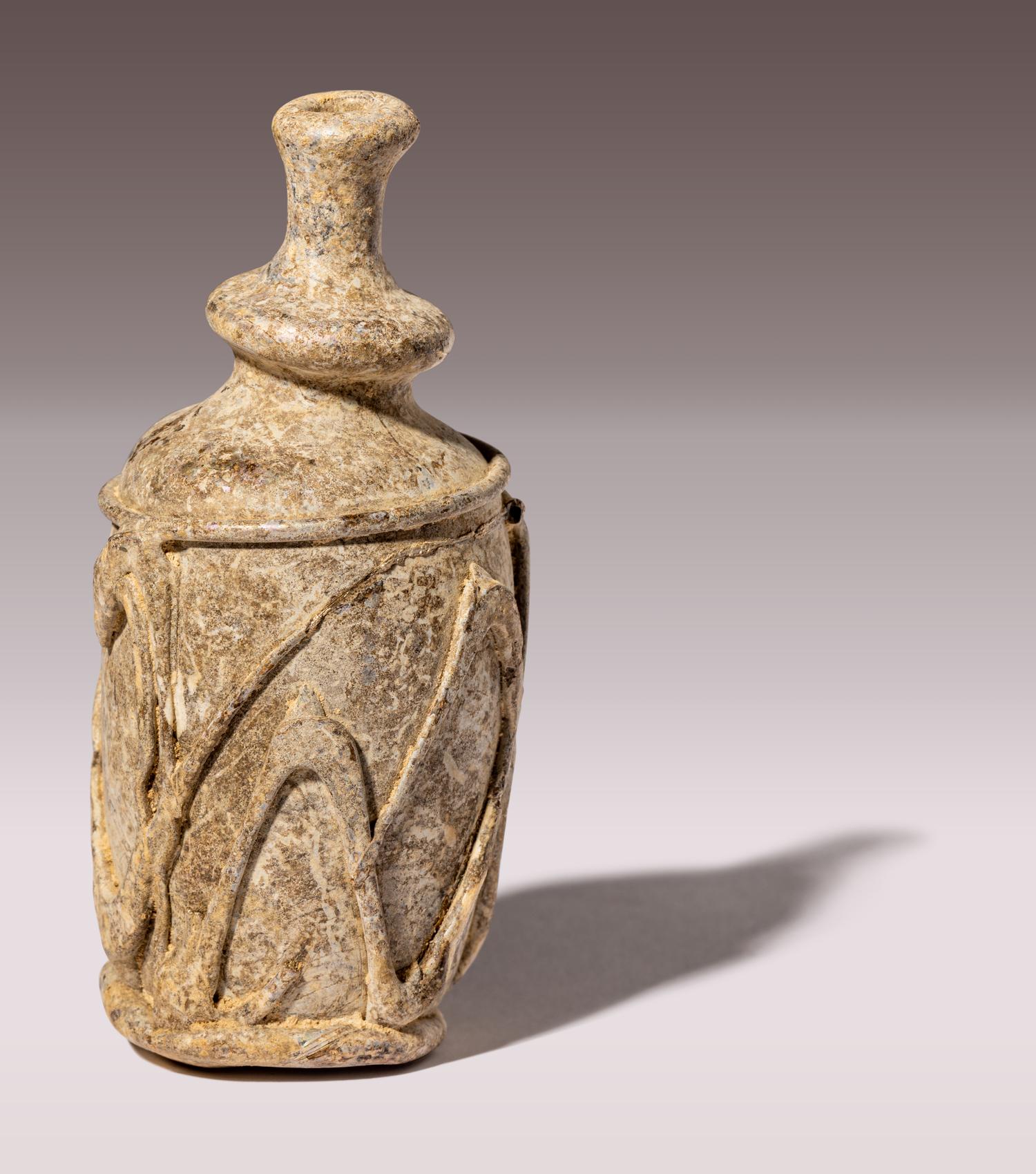 An Islamic Yellow-Green Glass Bottle