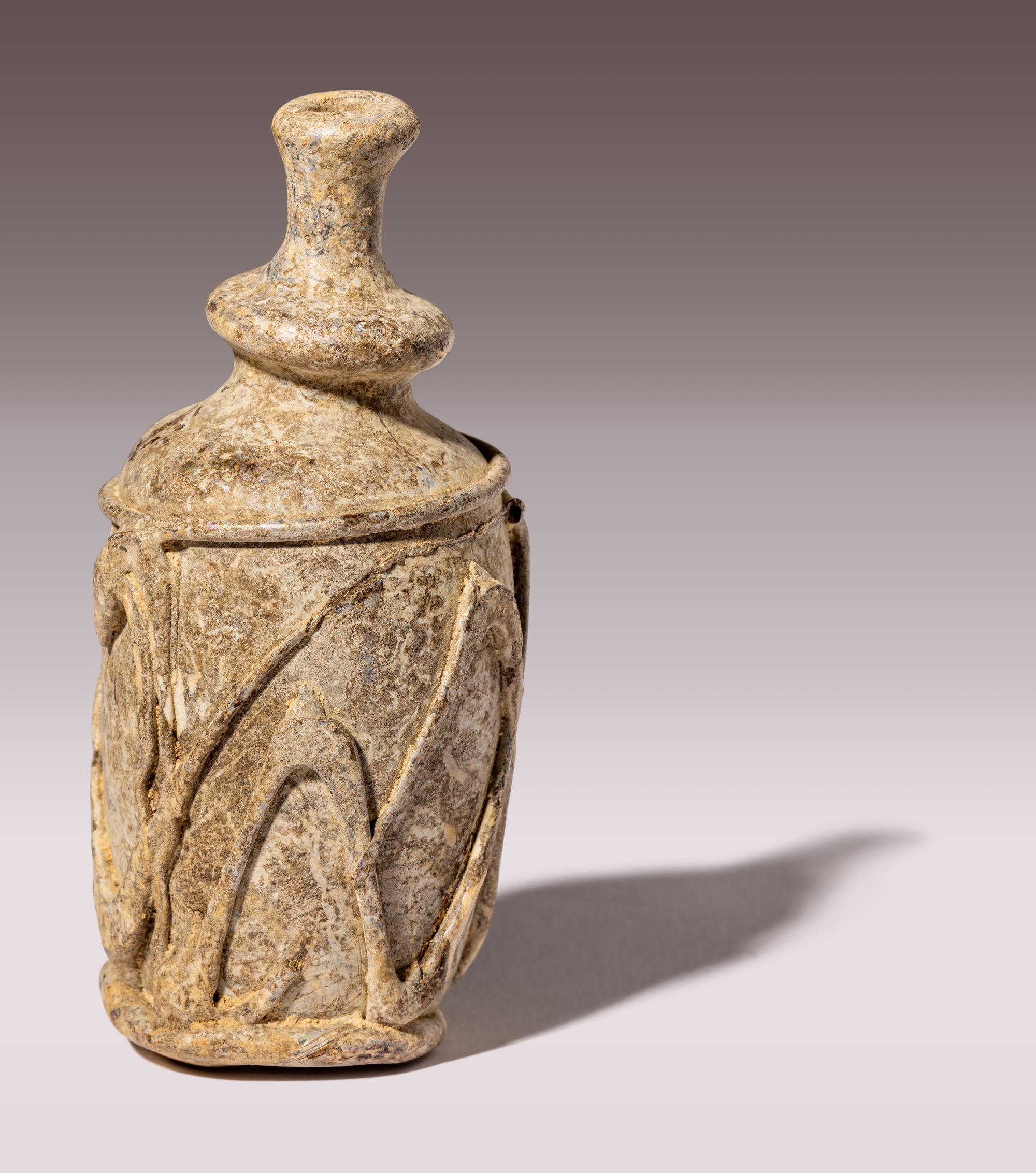 An Islamic Yellow-Green Glass Bottle