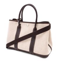 An Hermes Natural Canvas Garden Party PM Handbag, 12" x 8.5" x 5".