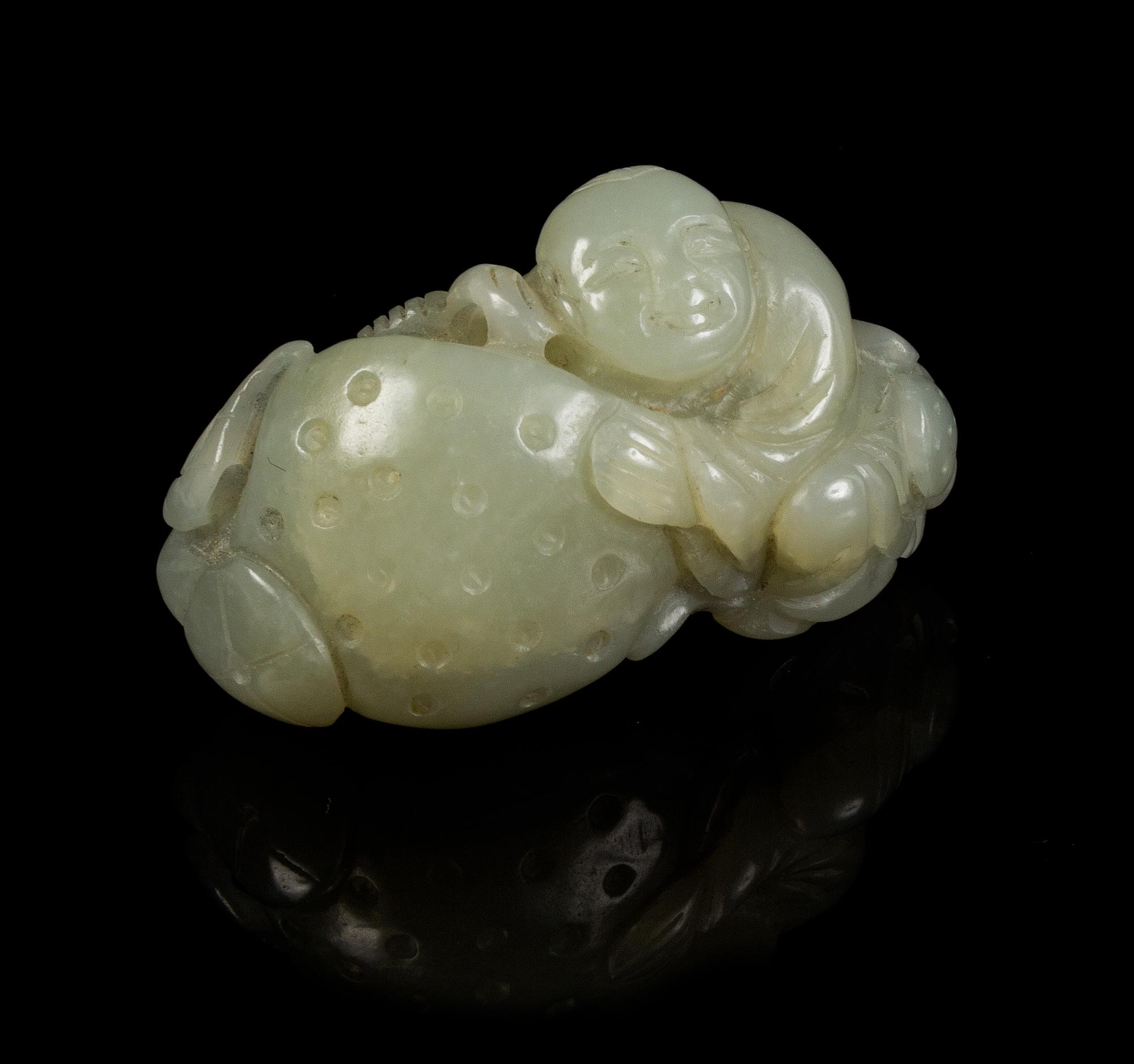 A Carved Jade Toggle Length 2 3/8 inches.