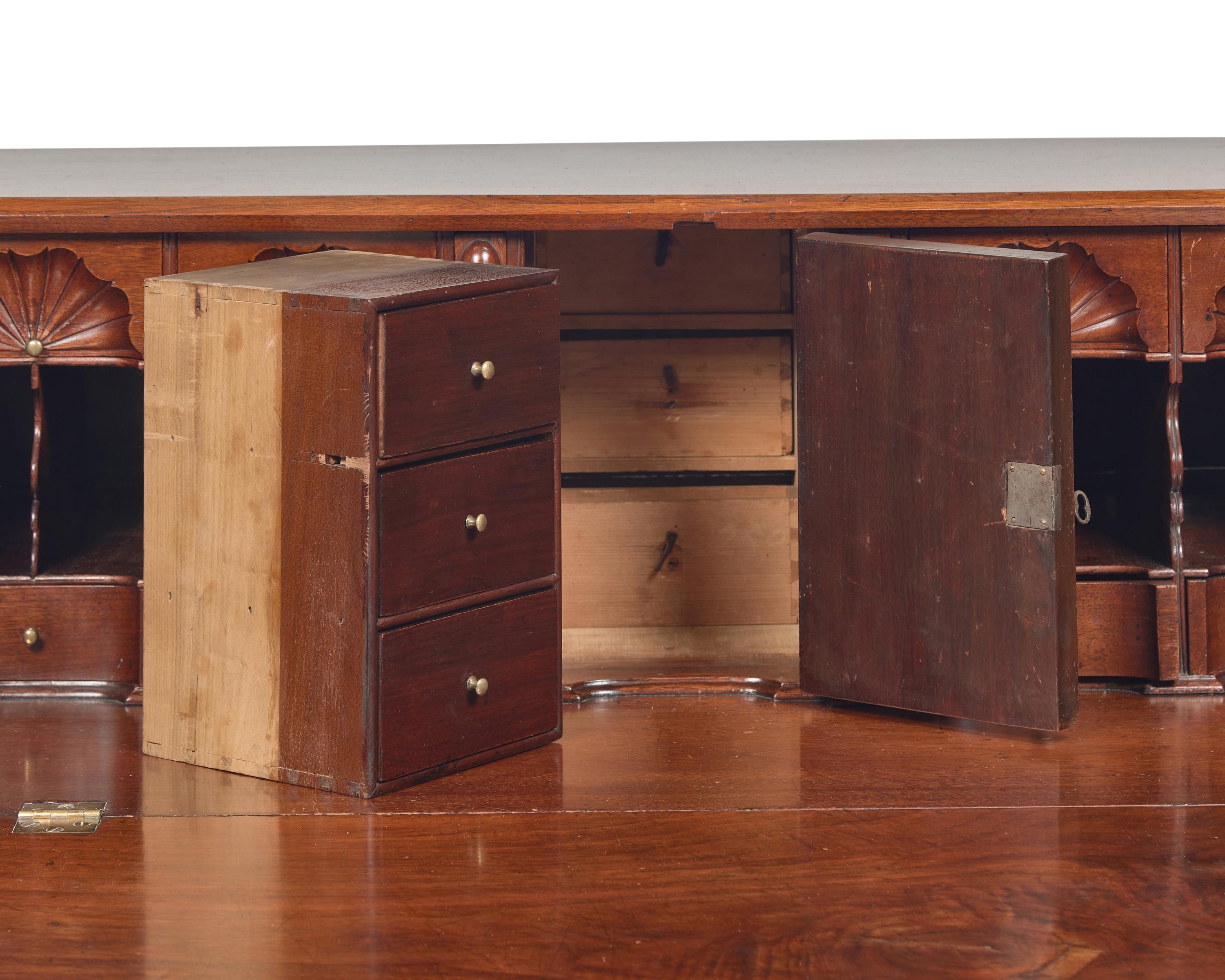A Chippendale Carved Walnut Slant-Front Desk