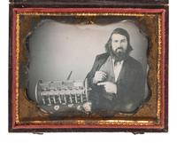 [EARLY PHOTOGRAPHY]. Quarter plate daguerreotype featuring a likely inventor posed with a model of a seed drill.