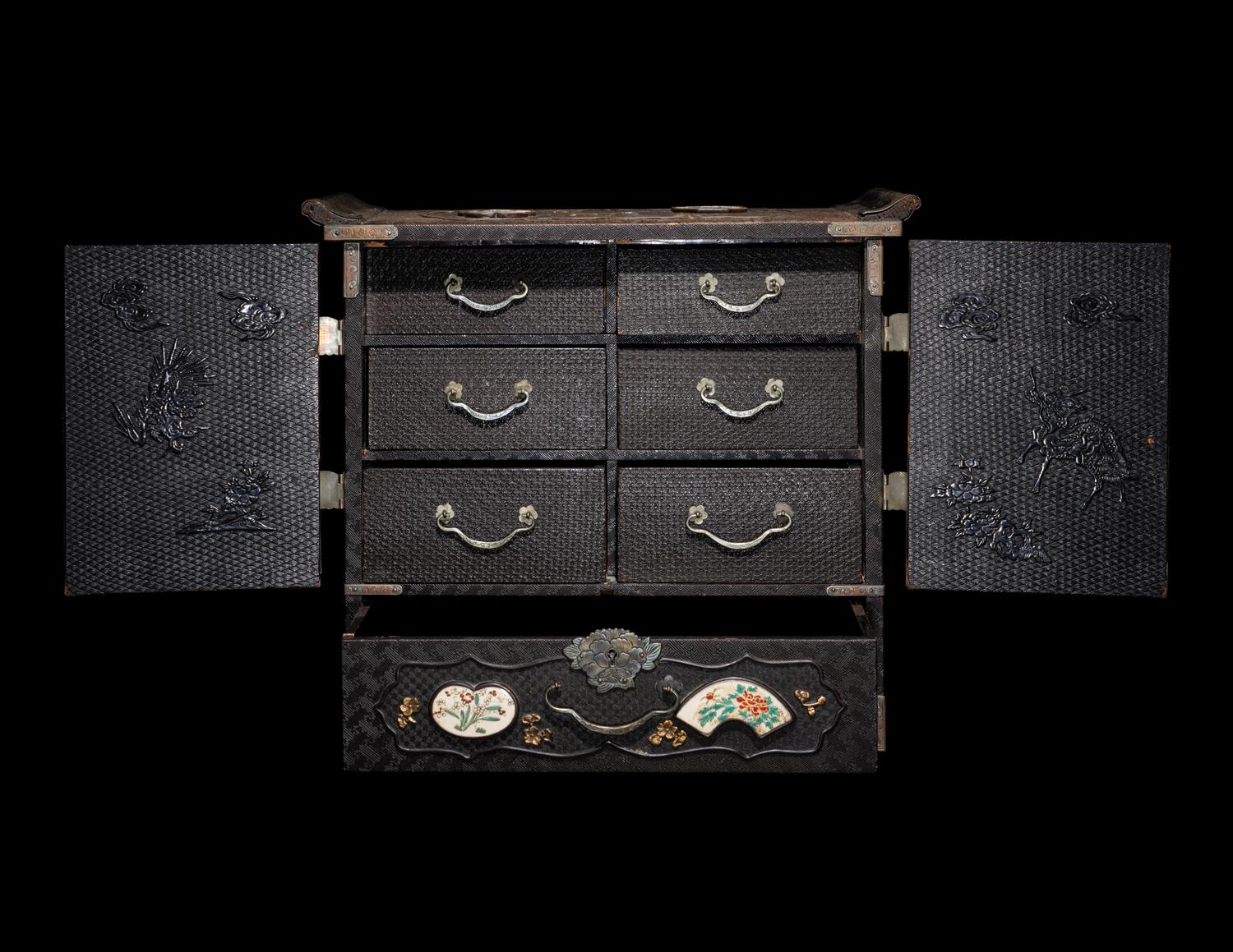 A Japanese Porcelain and Metal Inset Wood Chest