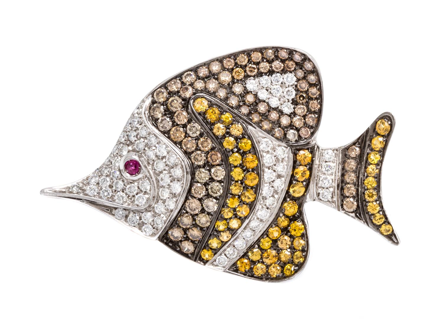 An 18 Karat White Gold, Diamond and Multi Gem Fish Pendant/Brooch, 12.60 dwts.