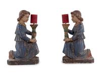 A Pair of Italian Carved and Polychrome Decorated Figural Candlesticks