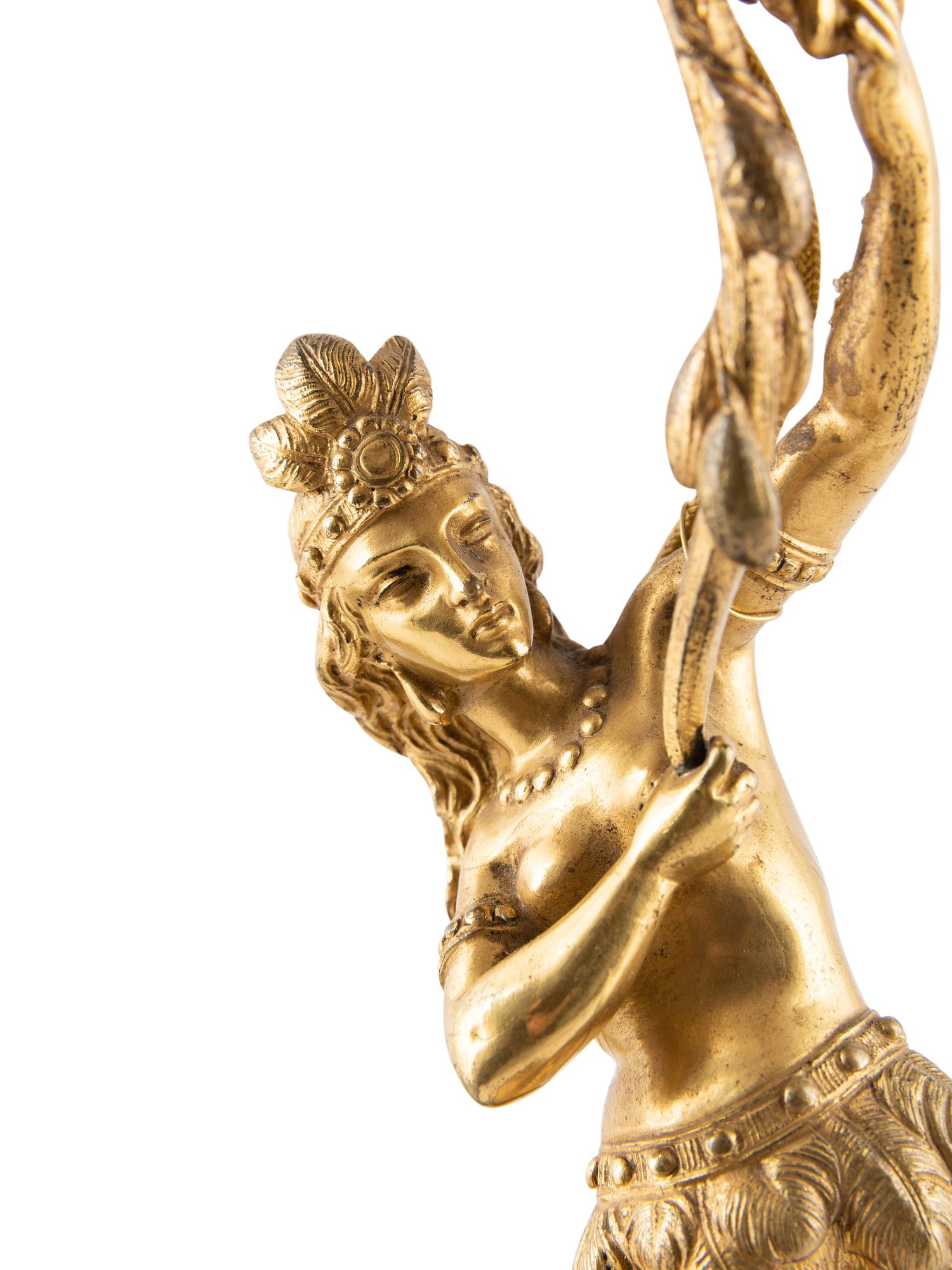A Pair of Figural Gilt Metal Candlesticks