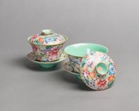 A Pair of Famille Rose Porcelain 'Millefleur' Tea Cups and Saucers Diameter of tea cup 4 1/8 inches. — 19TH CENTURY