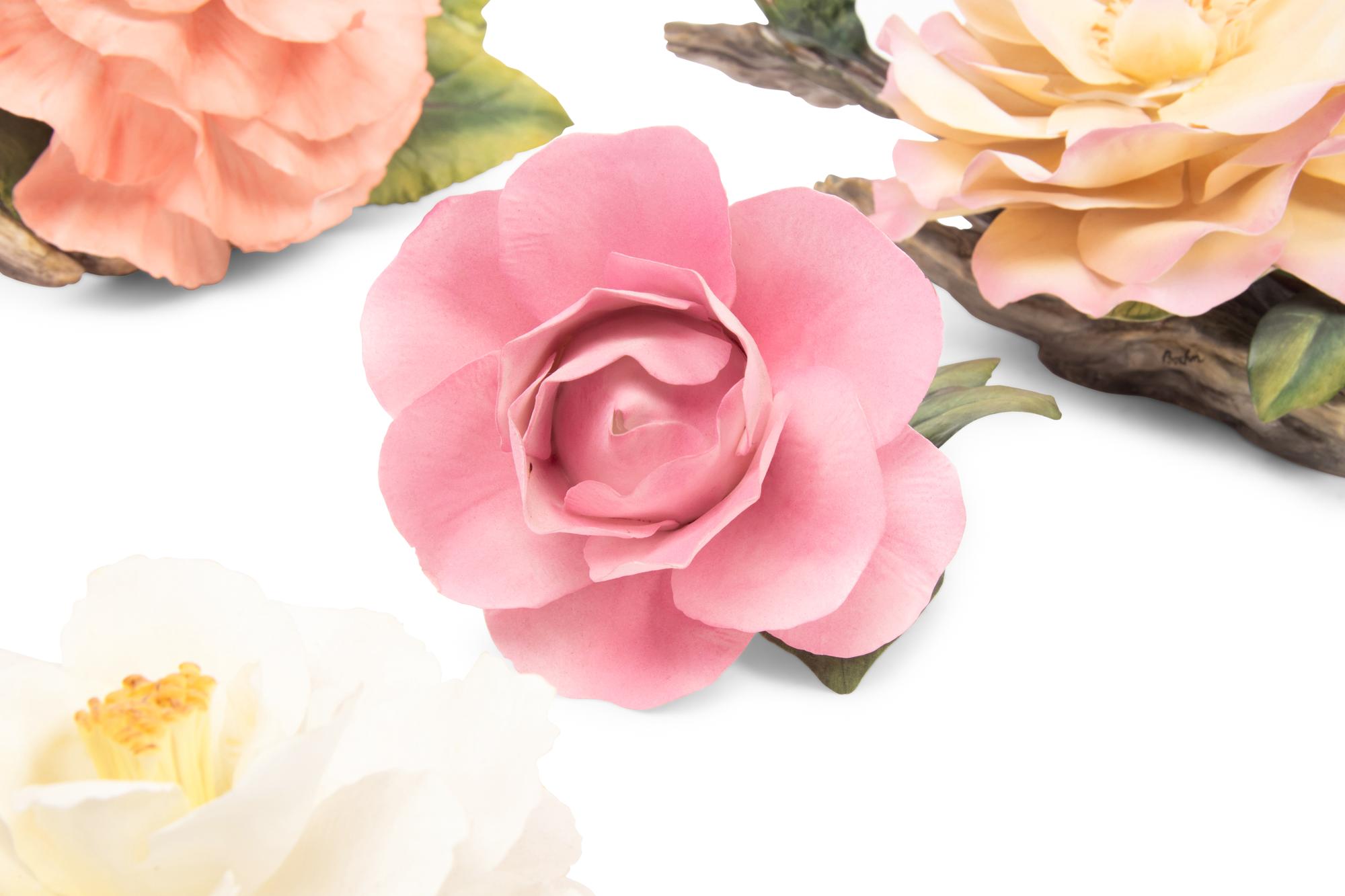 A Group of Seven Porcelain Flowers