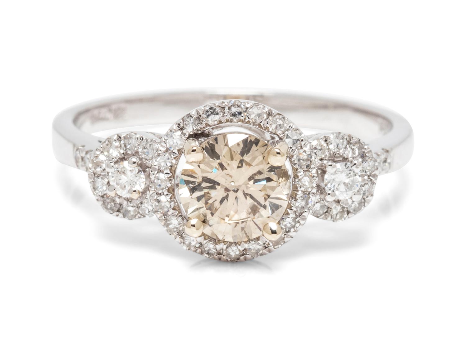 An 18 Karat White Gold, Colored Diamond and Diamond Ring,