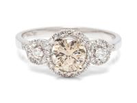 An 18 Karat White Gold, Colored Diamond and Diamond Ring,