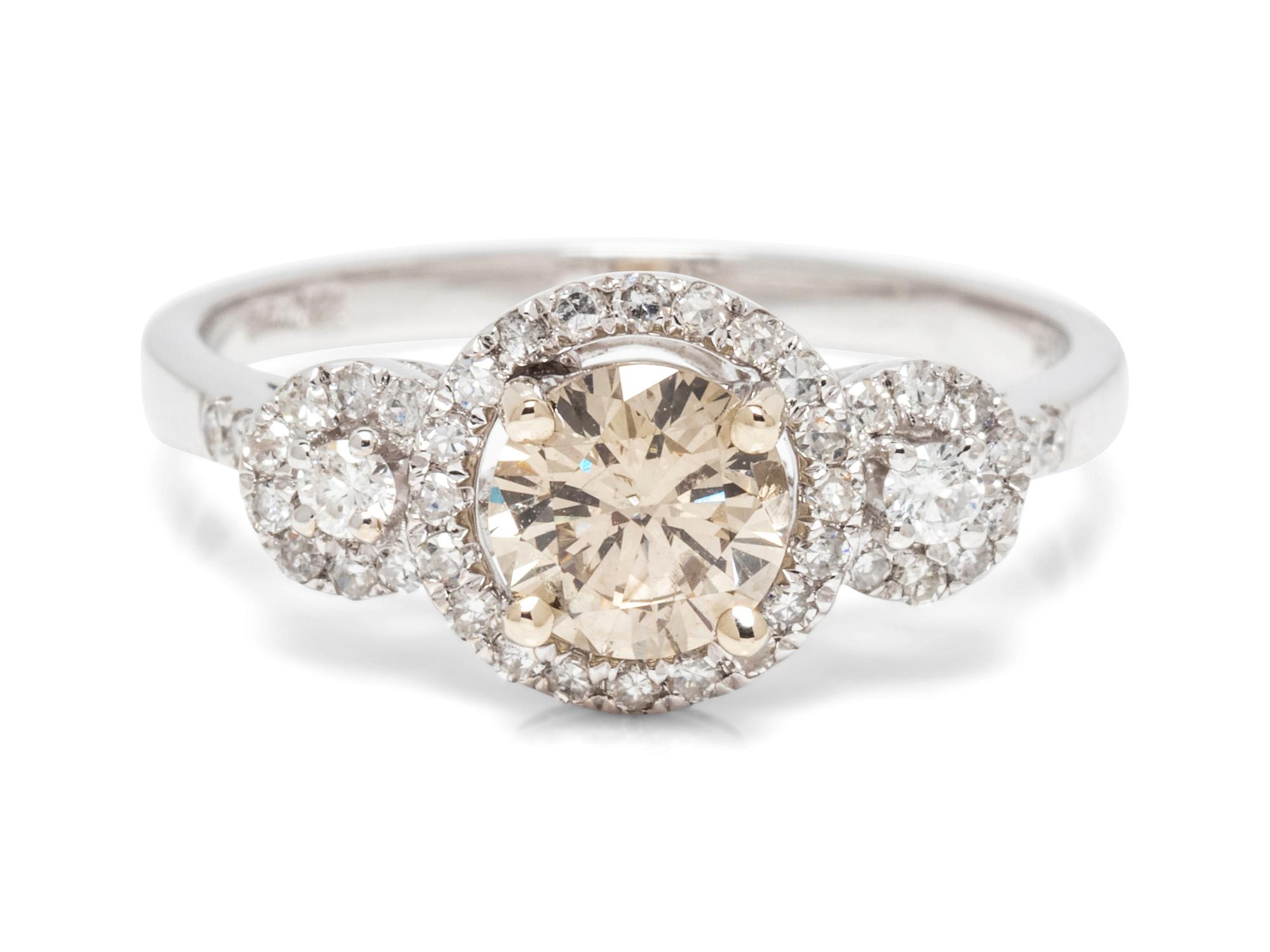 An 18 Karat White Gold, Colored Diamond and Diamond Ring,