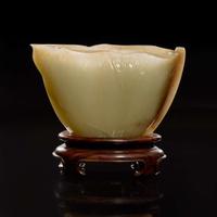 A Chinese carved celadon jade "Lotus" coupe 蓮葉玉杯