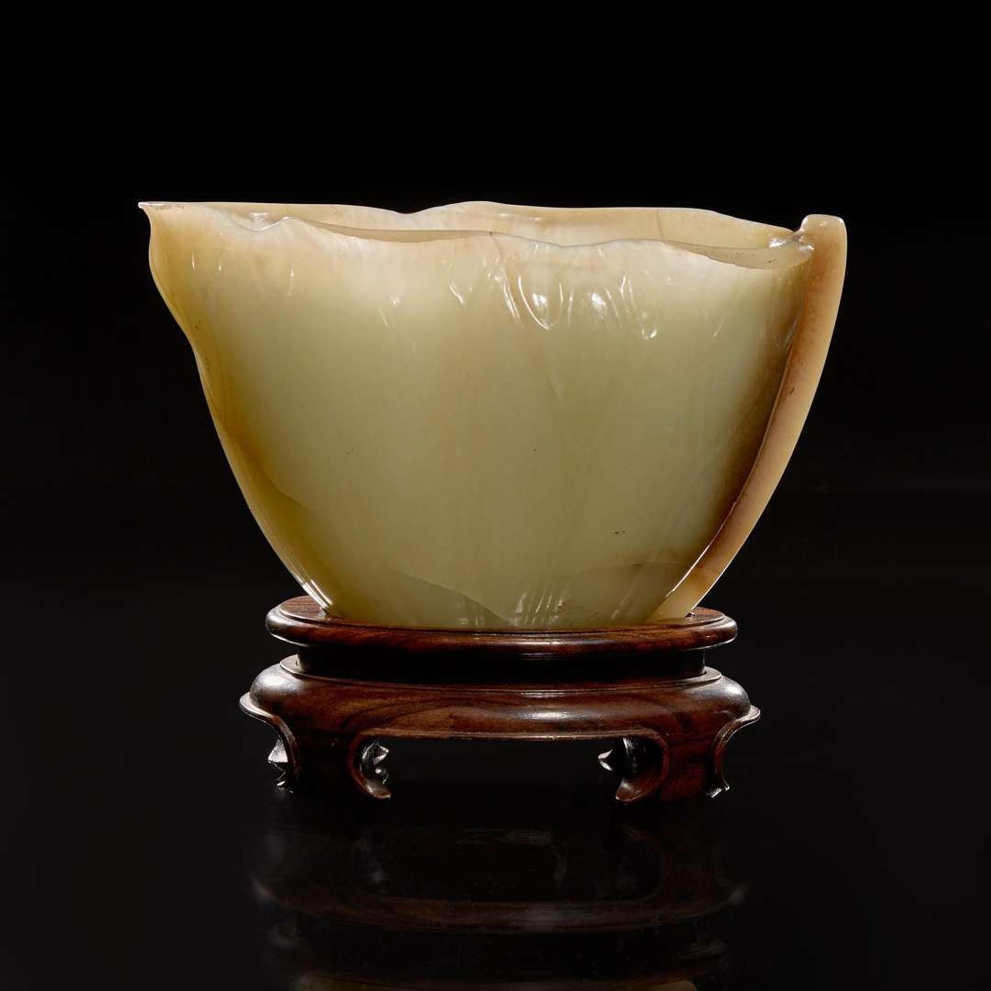 A Chinese carved celadon jade "Lotus" coupe 蓮葉玉杯