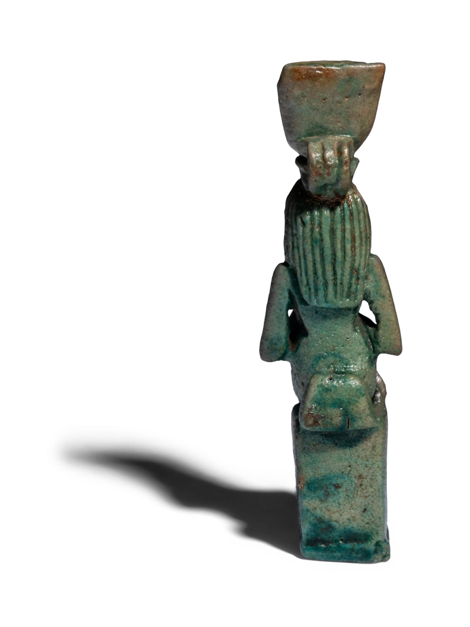 An Egyptian Faience Isis Nursing Horus Amulet