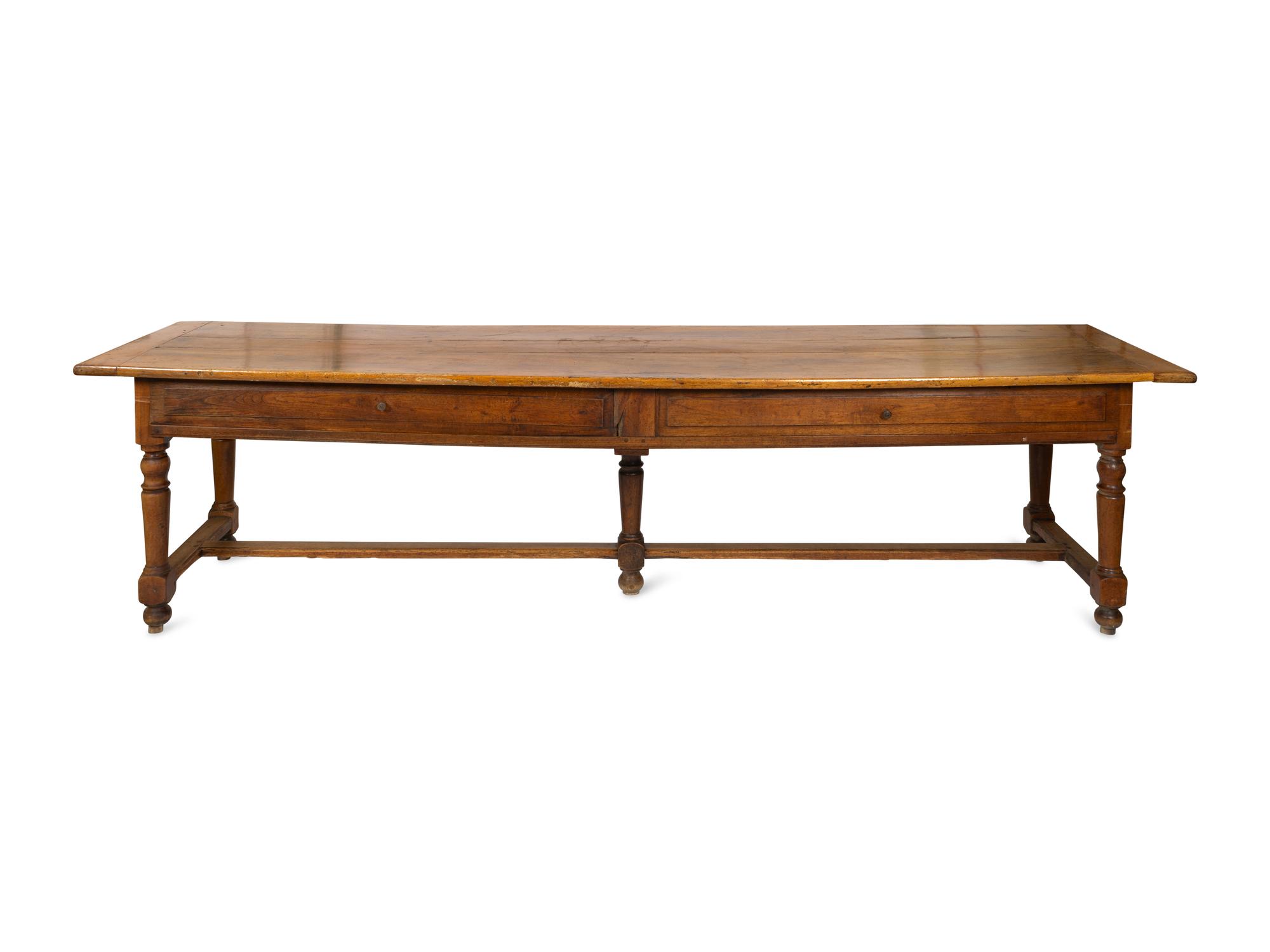 A Large Continental Fruitwood Refectory Table with Stretcher