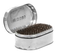 A George III Silver Nutmeg Grater, Maker's Mark I.H., London, 1796, of oval form, the hinged lid opening to a grater with a hinged base