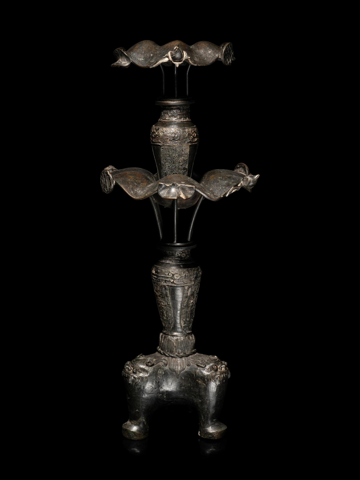 A Large Pair of Bronze Candle Holders