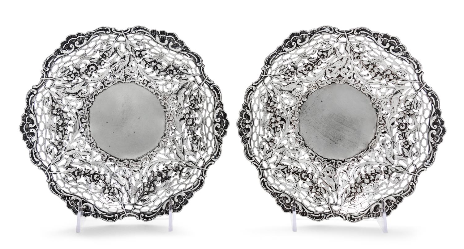 A Pair of Continental Silver Bowls, Maker's Mark HSS centering a star, each having pierced sides decorated with foliate scrolls, fruit