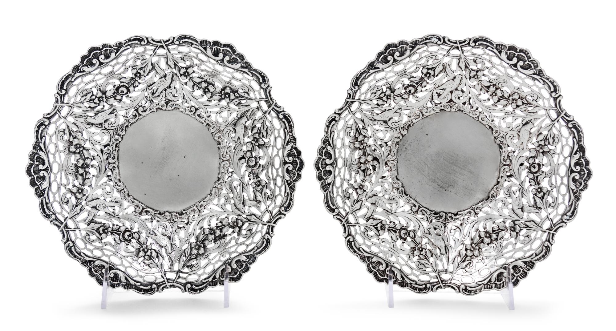 A Pair of Continental Silver Bowls, Maker's Mark HSS centering a star, each having pierced sides decorated with foliate scrolls, fruit