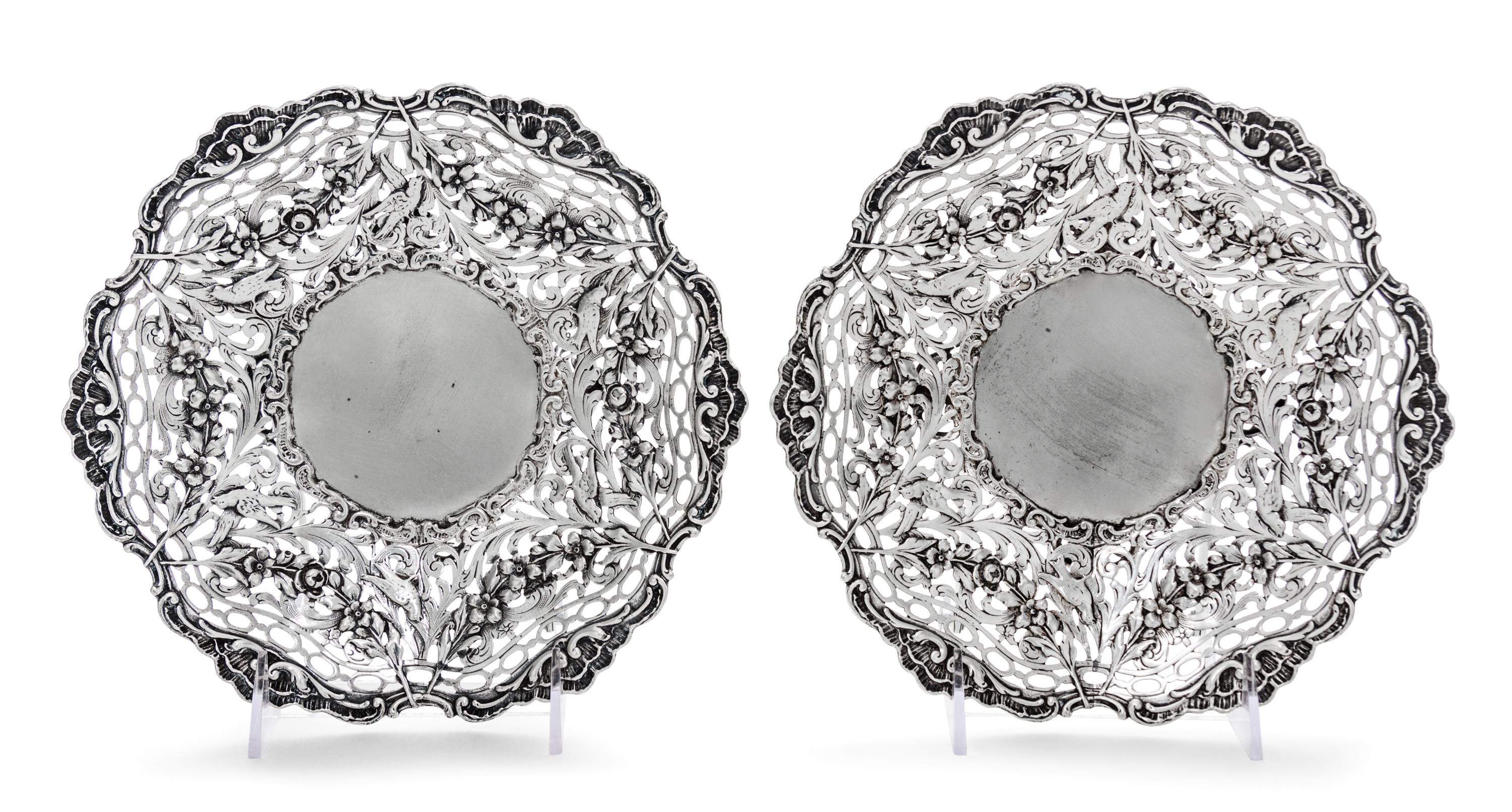 A Pair of Continental Silver Bowls, Maker's Mark HSS centering a star, each having pierced sides decorated with foliate scrolls, fruit