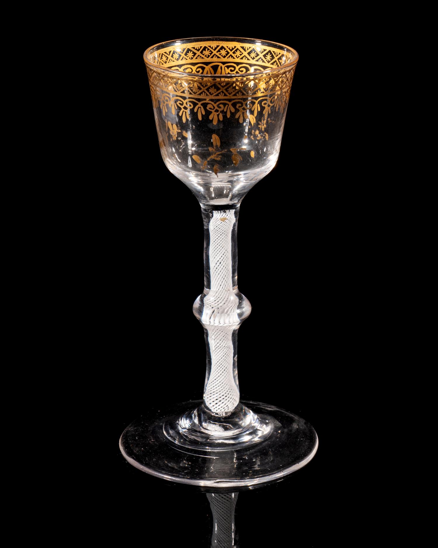 A Giles Gilt Decorated Opaque Twist Knopped Wine Glass