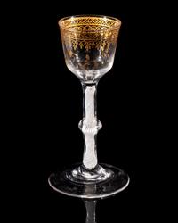 A Giles Gilt Decorated Opaque Twist Knopped Wine Glass