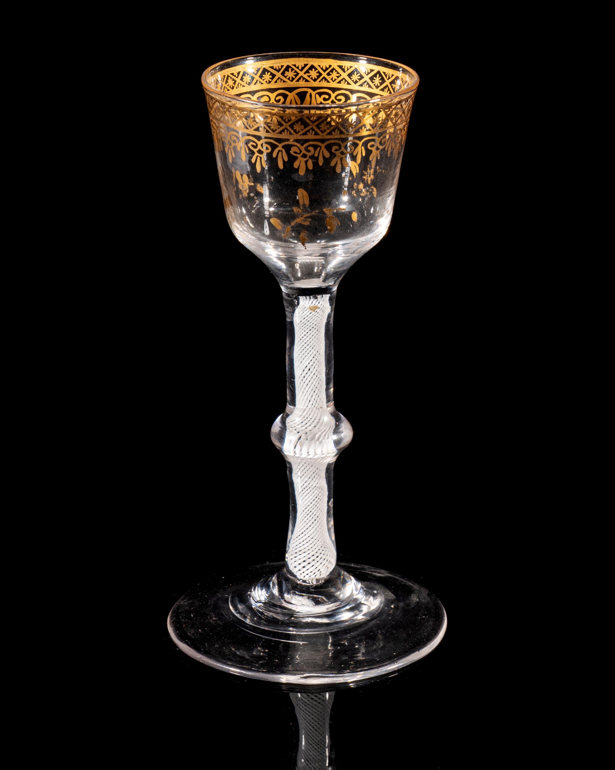 A Giles Gilt Decorated Opaque Twist Knopped Wine Glass