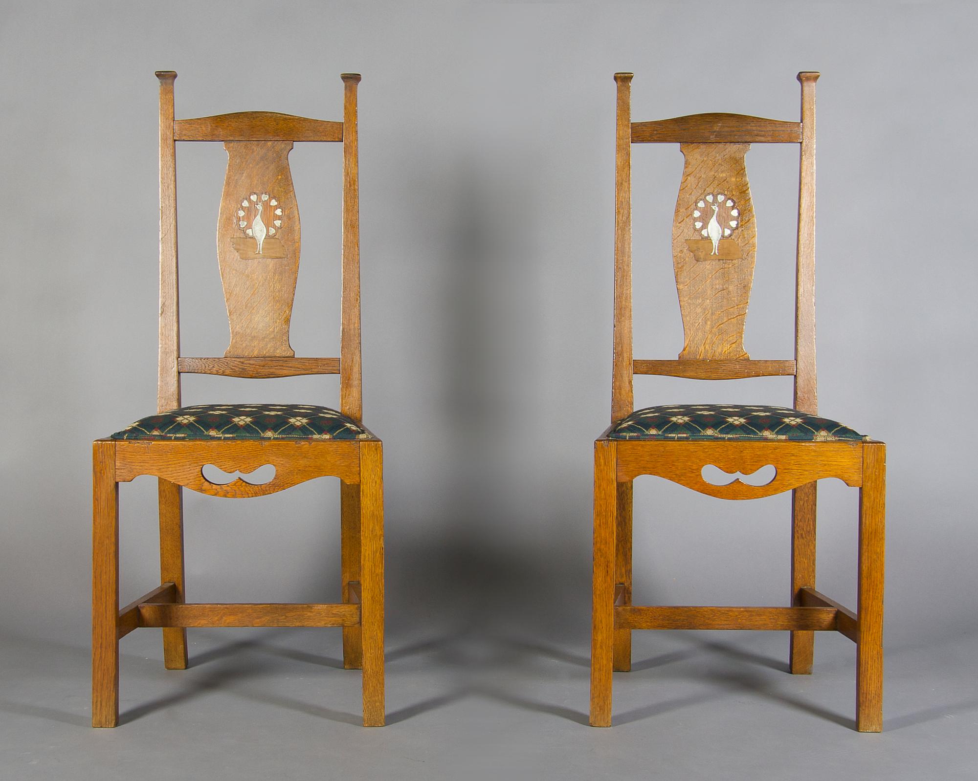 A Pair of Arts and Crafts Oak Side Chairs, After Charles Francis Annesley Voysey, Height 41 3/4 inches.