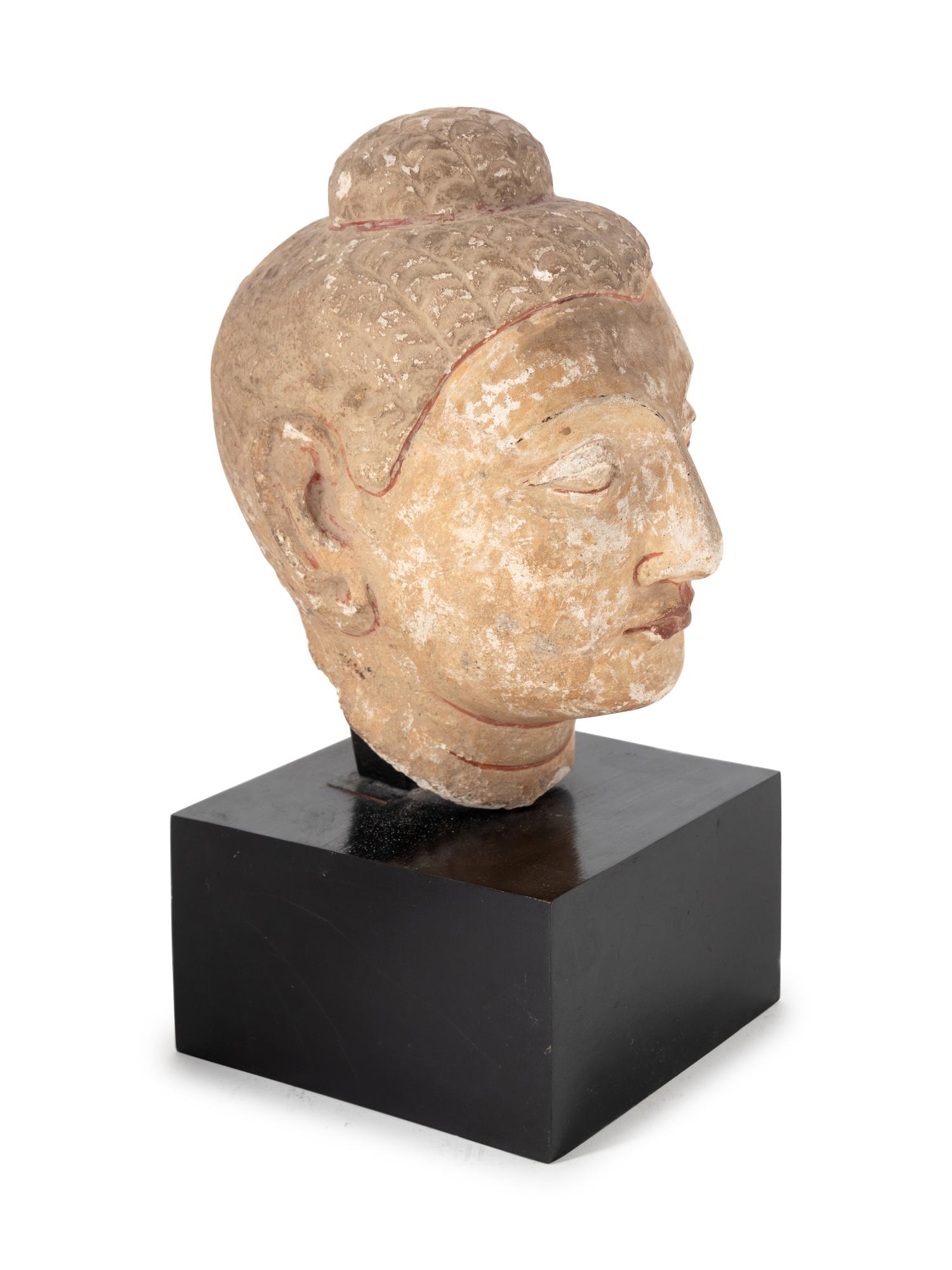 A Cambodian Style Painted Stone Head of Buddha