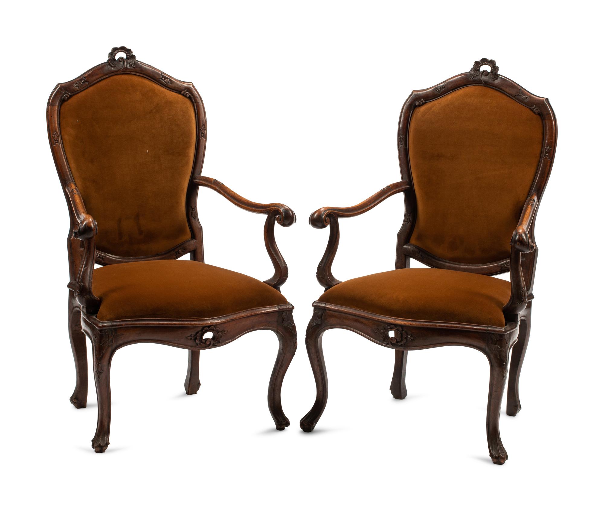 A Pair of Venetian Carved Walnut Armchairs