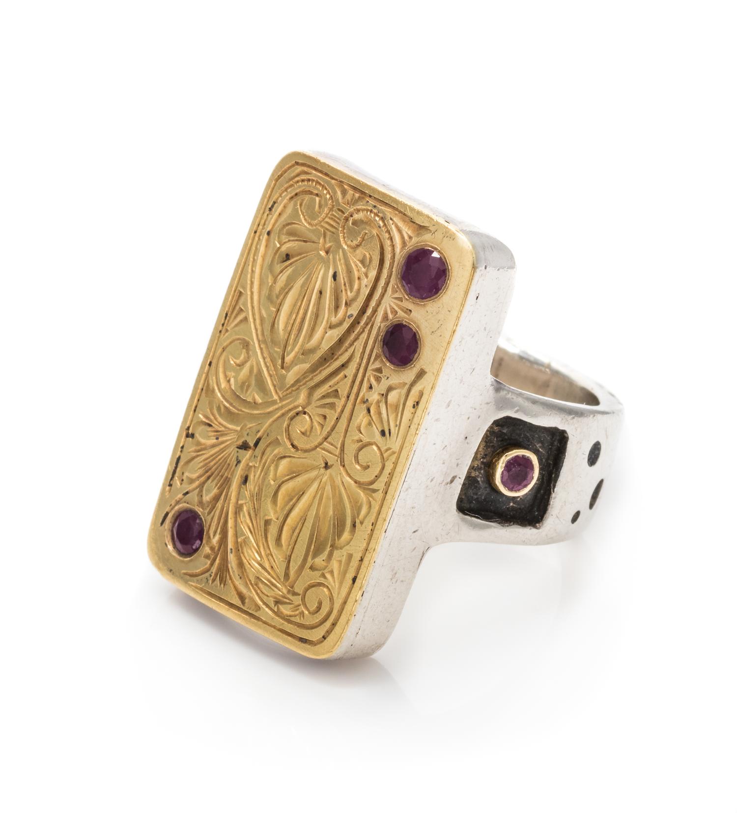 An 18 Karat Yellow Gold, Sterling Silver and Ruby Ring, 12.00 dwts.