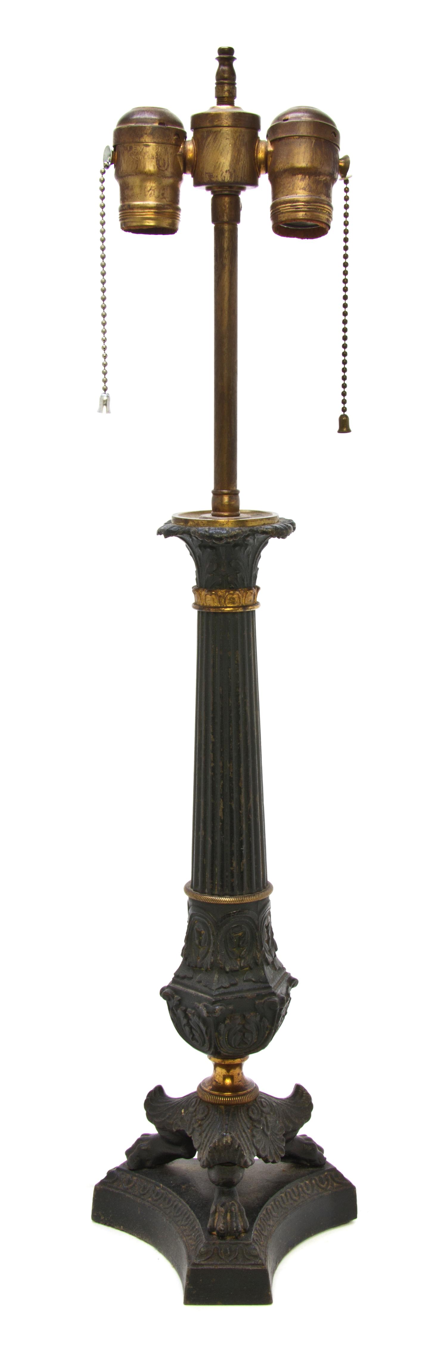 A Neoclassical Gilt and Patinated Cast Metal Table Lamp, Height overall 25 1/2 inches.