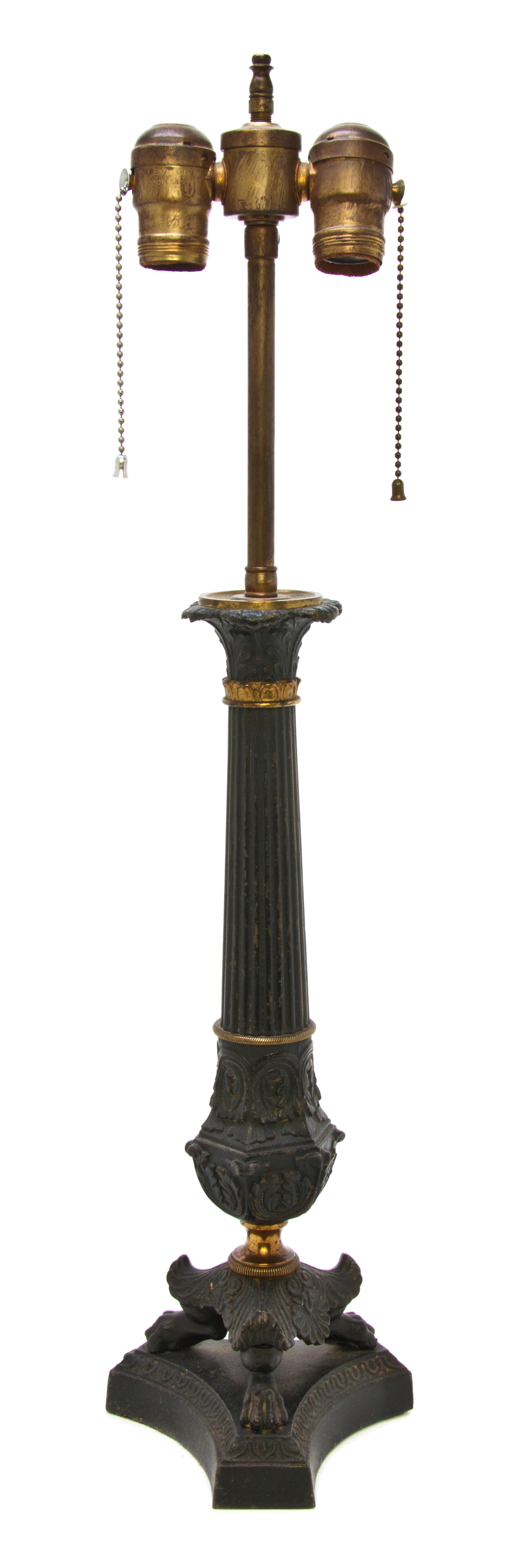 A Neoclassical Gilt and Patinated Cast Metal Table Lamp, Height overall 25 1/2 inches.