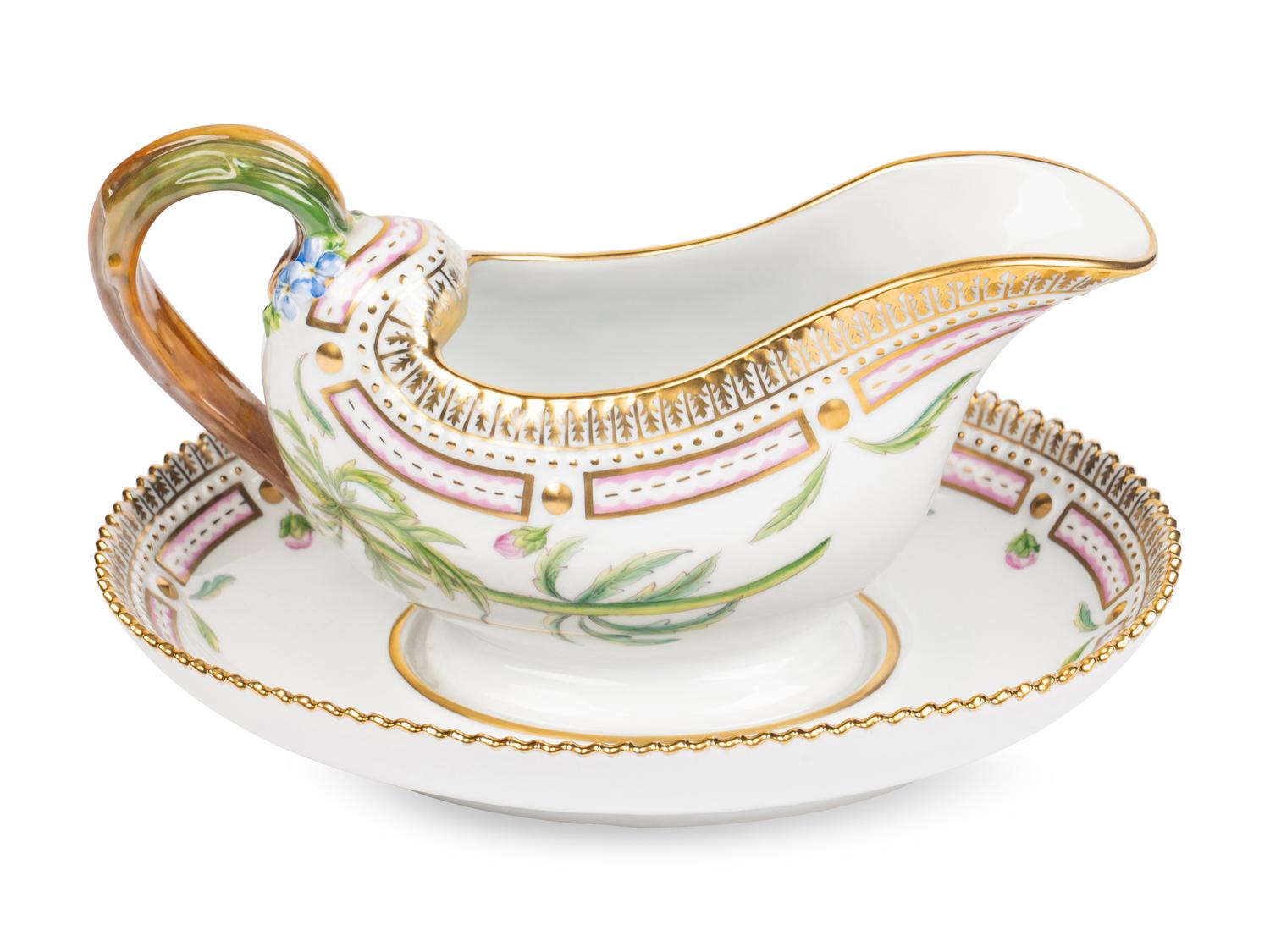 A Royal Copenhagen Flora Danica Porcelain Sauce Boat and Fixed Stand